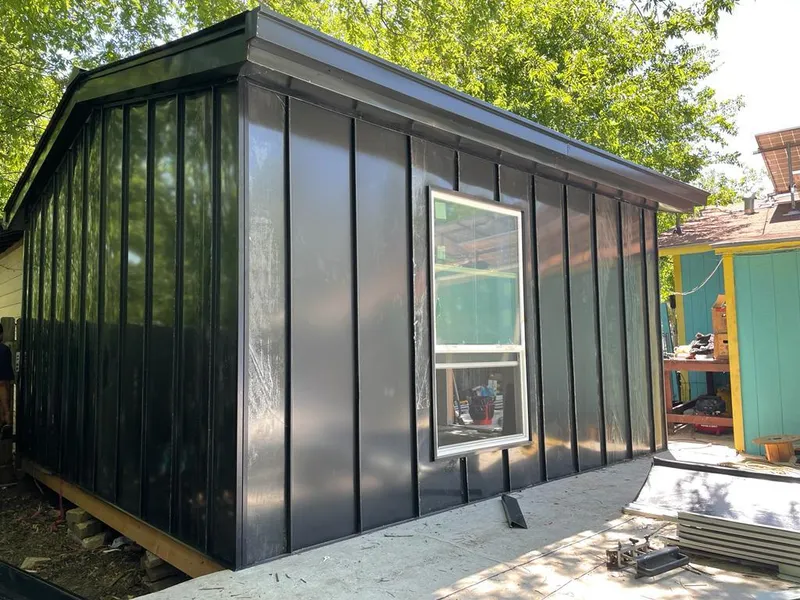 Black standing seam metal wall panels for Roof Inspection in Normal